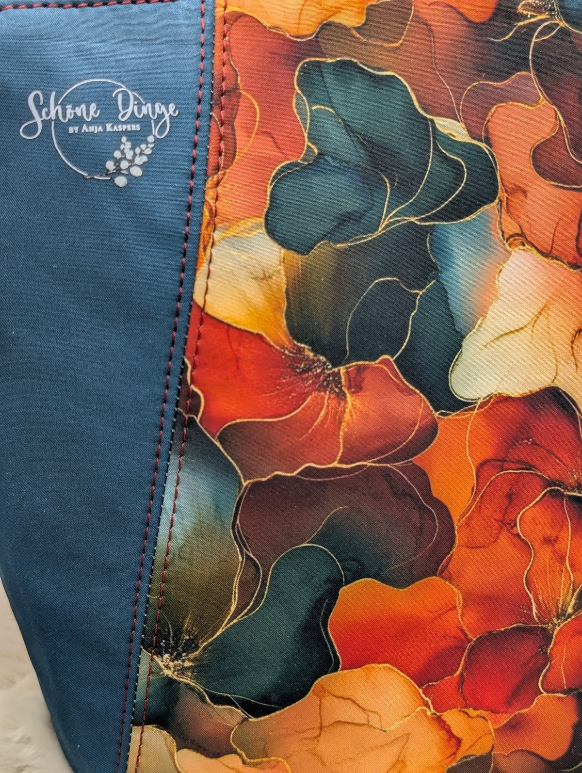 Handgemachte Softshell-Tasche mit Blumenmuster in Petrol/Orange/Rot